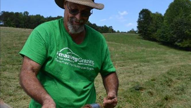 Mike holds soil samples Mike with soil samples